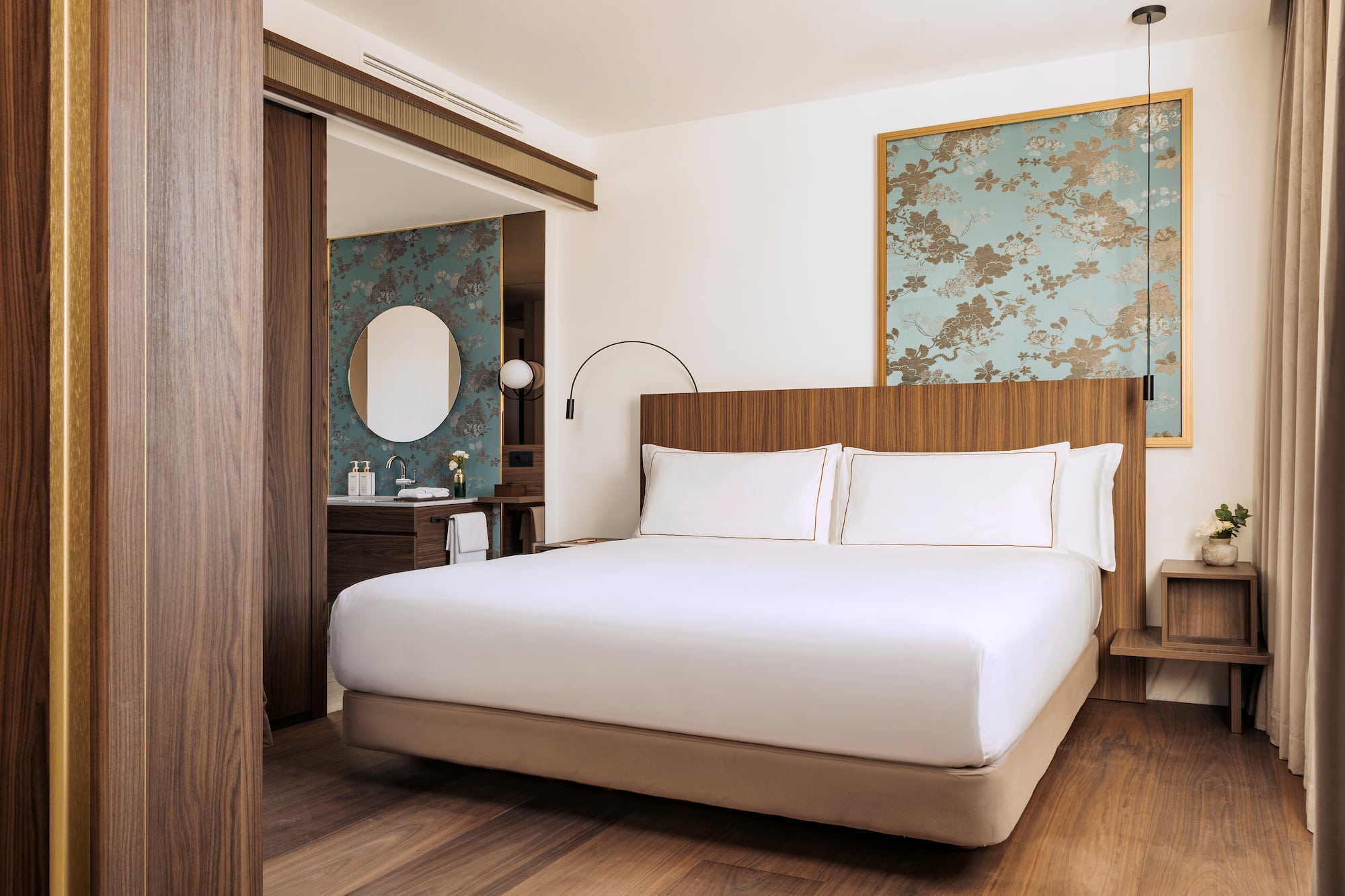 a bedroom with a bed and a mirror