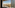 Panoramic Paris hotel view with Eiffel Tower, Seine River, cityscape.