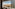 Panoramic Paris hotel view with Eiffel Tower, Seine River, cityscape.