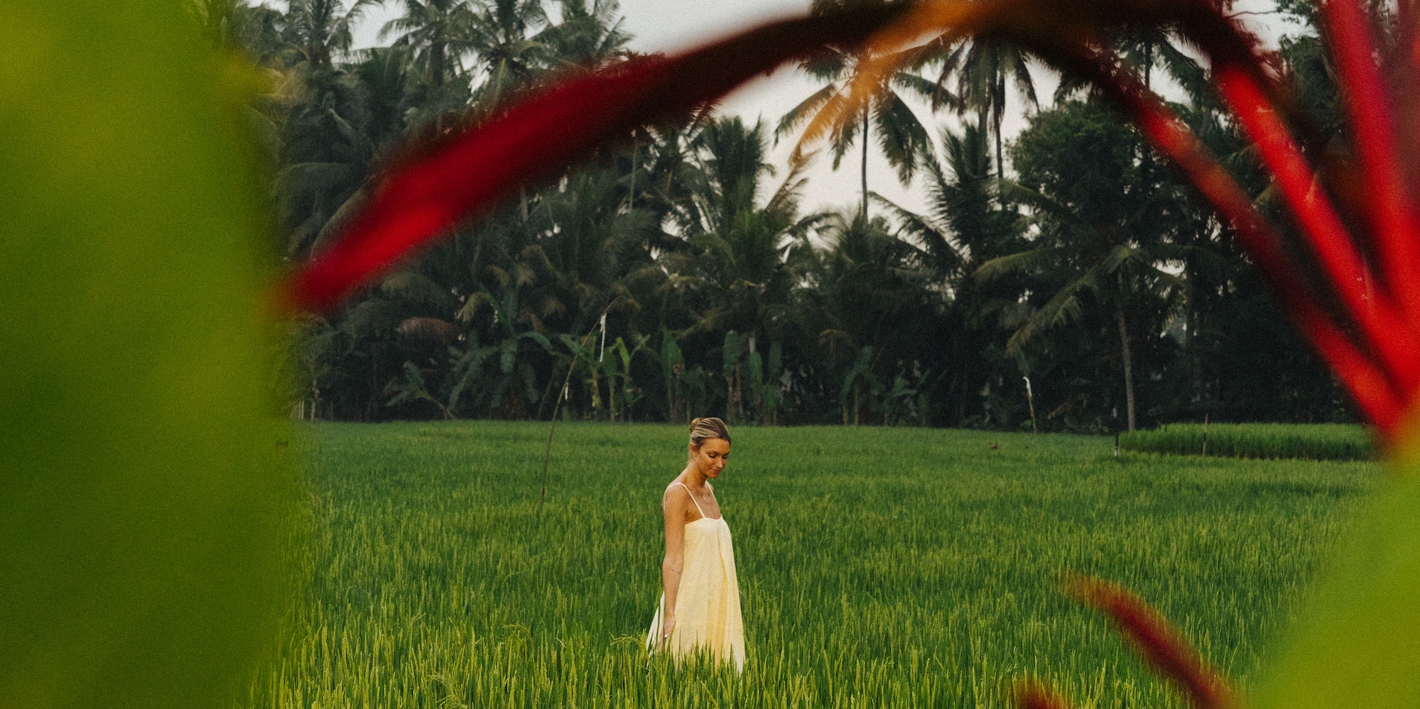 a woman standing in a field of grass