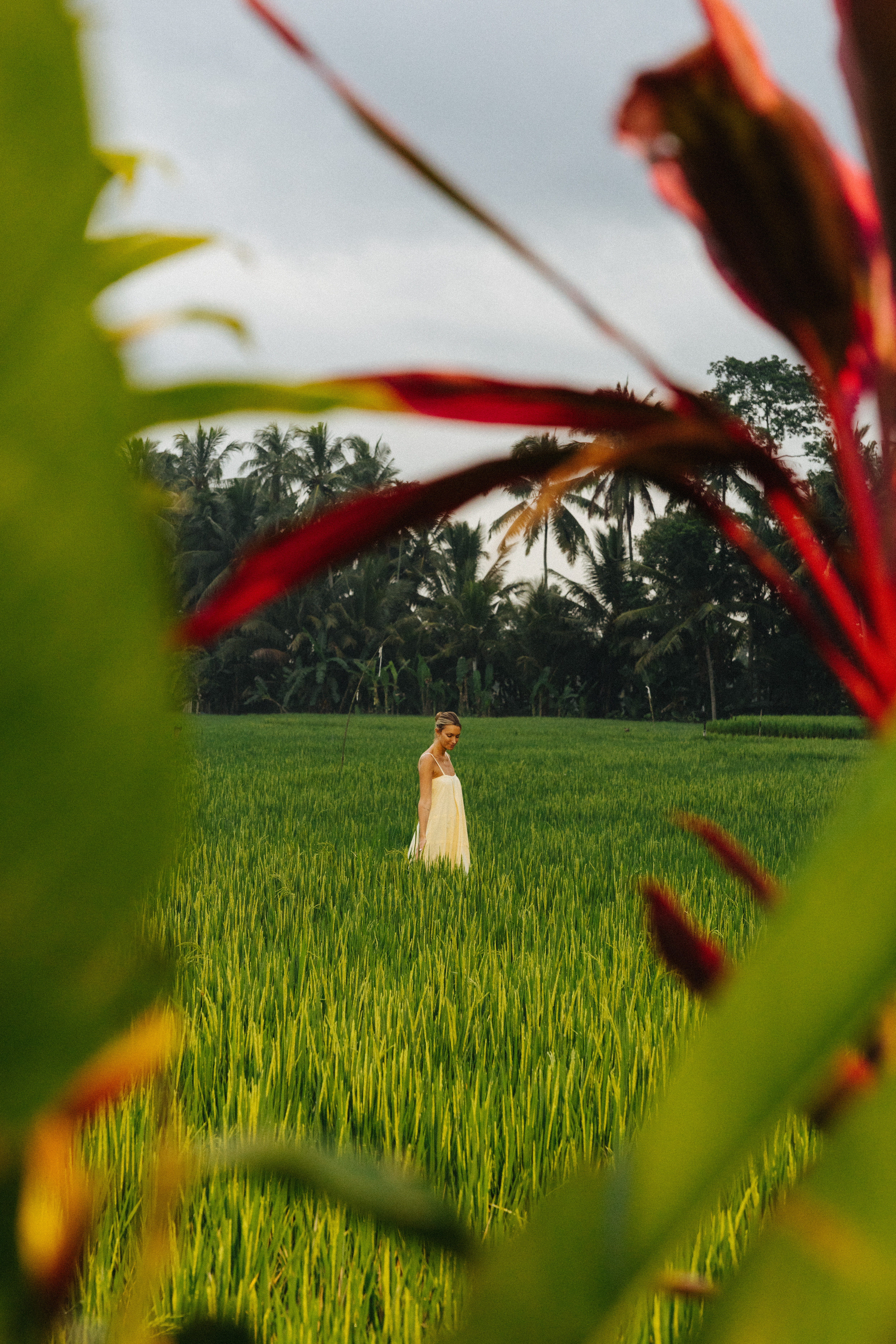a woman standing in a field of grass