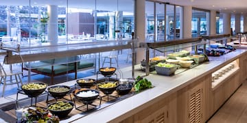 a buffet line with food on it