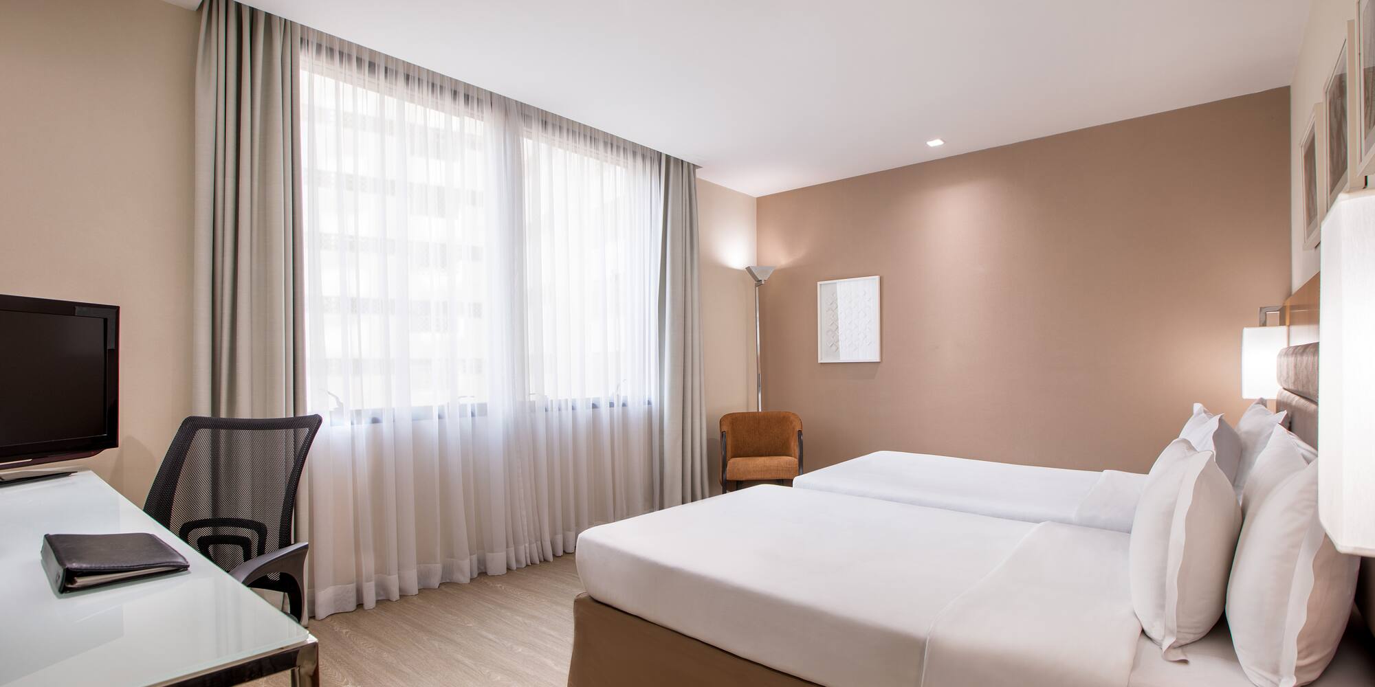 a room with a bed and a desk