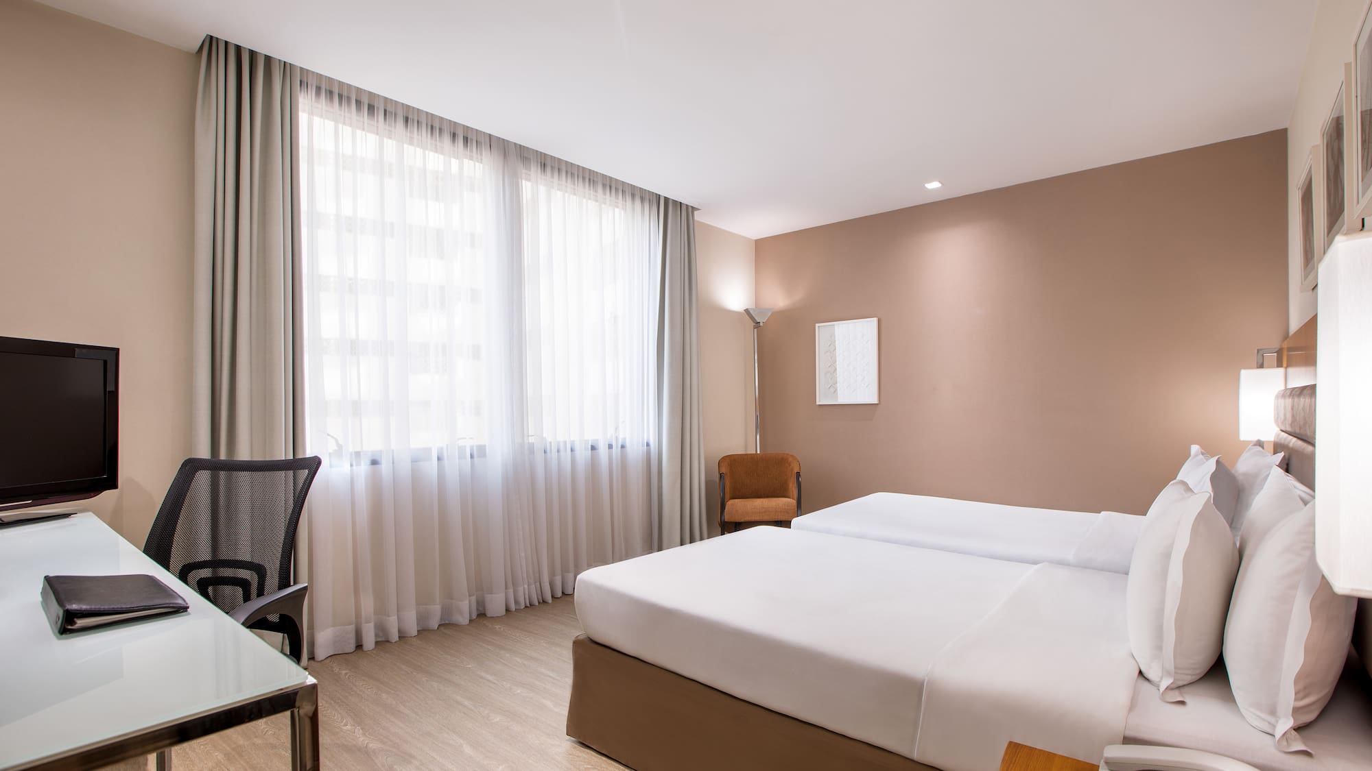 a room with a bed and a desk