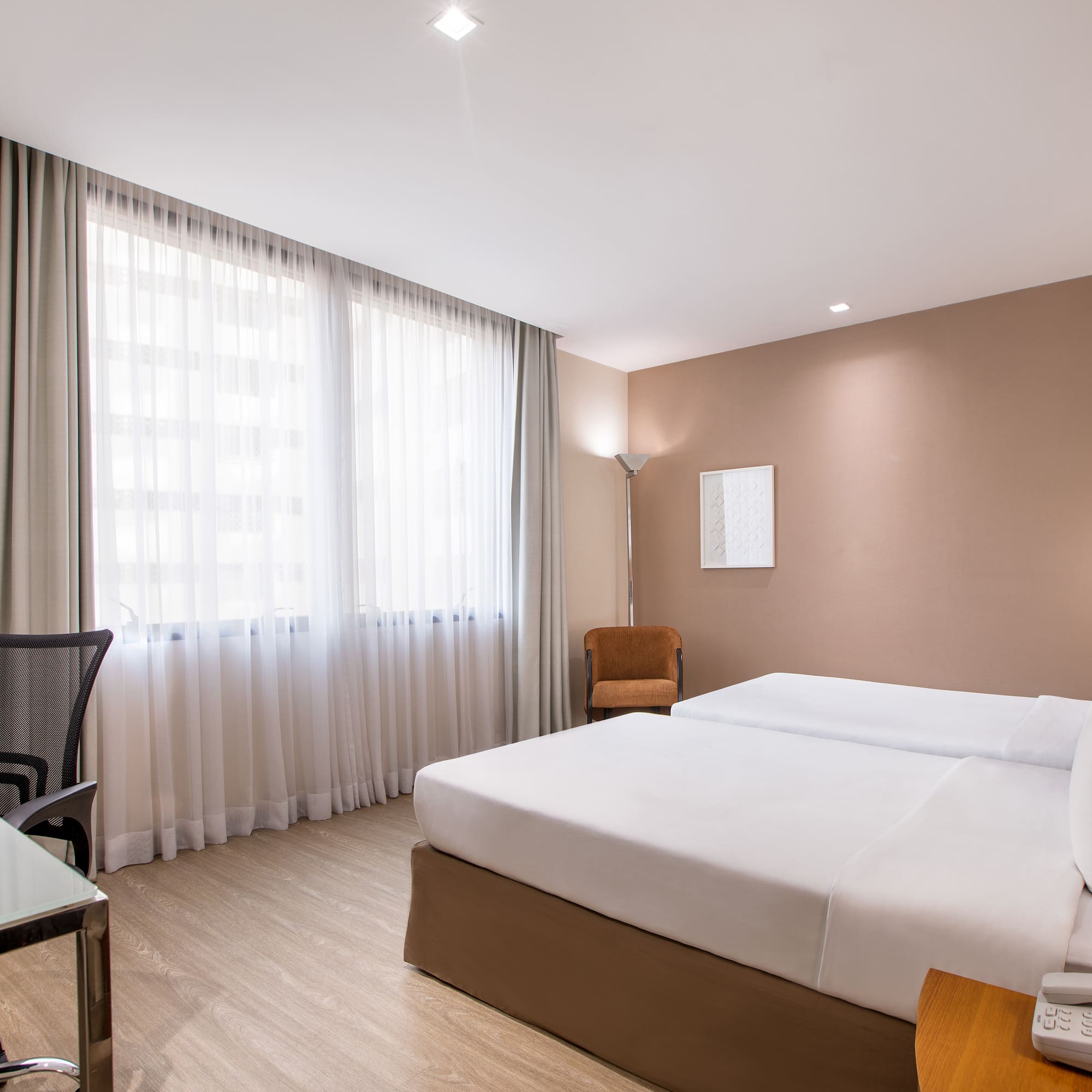 a room with a bed and a desk