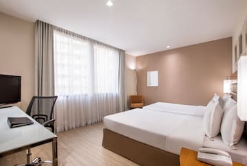 a room with a bed and a desk