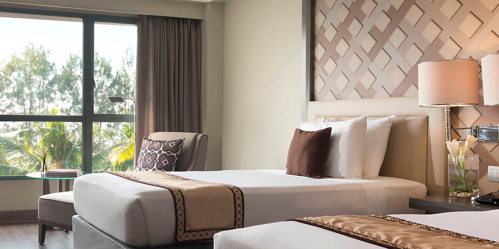 a room with two beds and a window