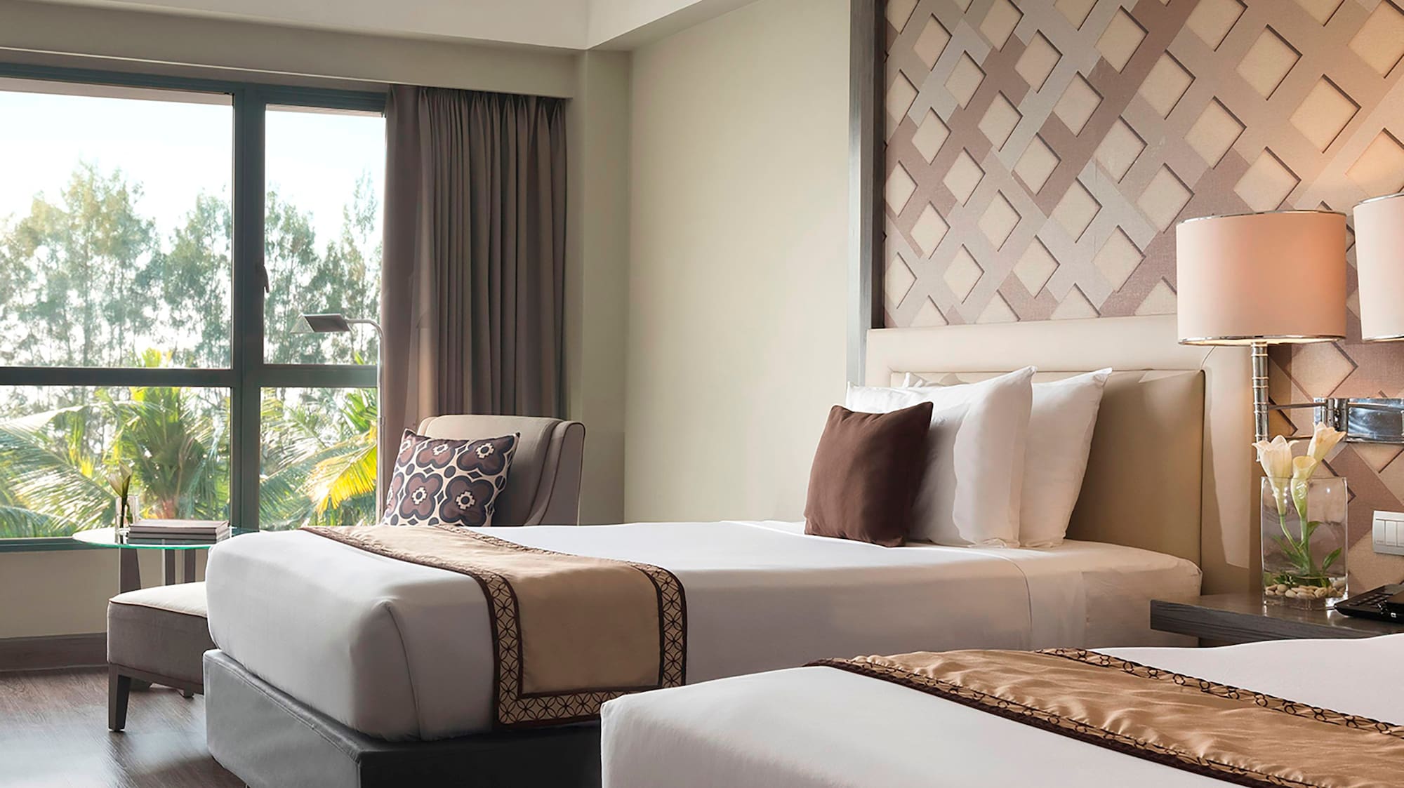 a room with two beds and a window