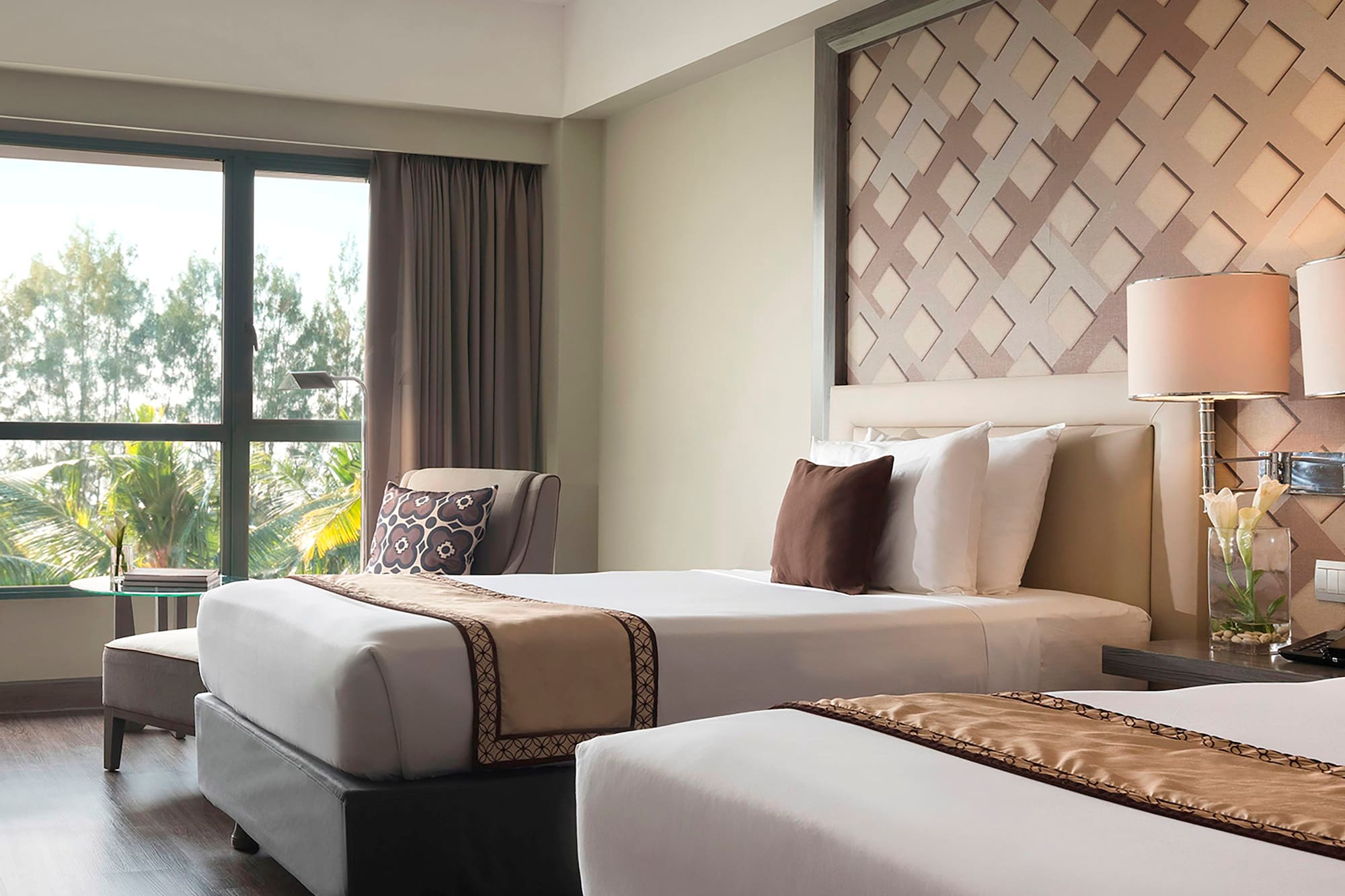 a room with two beds and a window