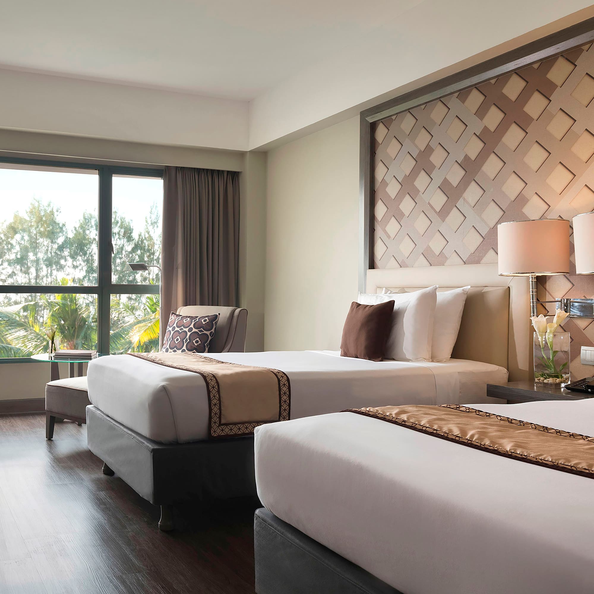 a room with two beds and a window