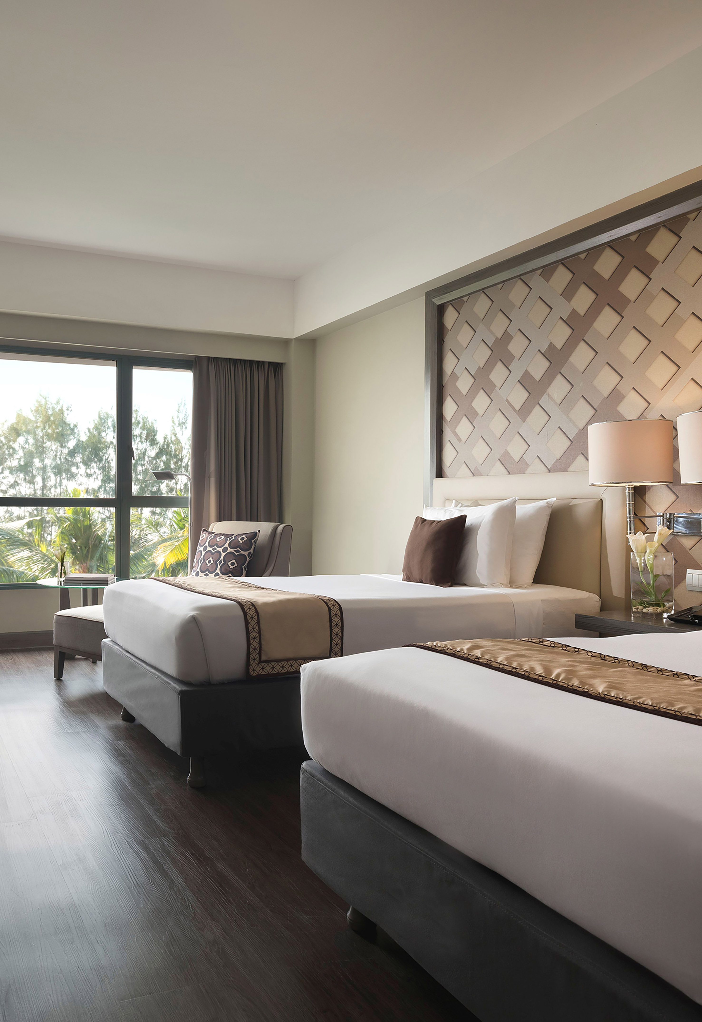 a room with two beds and a window