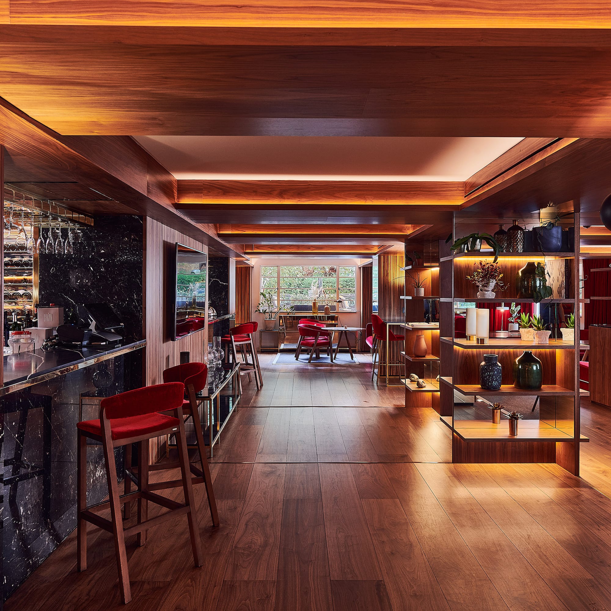 a room with a bar and shelves