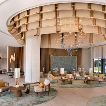 a large lobby with a large round ceiling and a large round table
