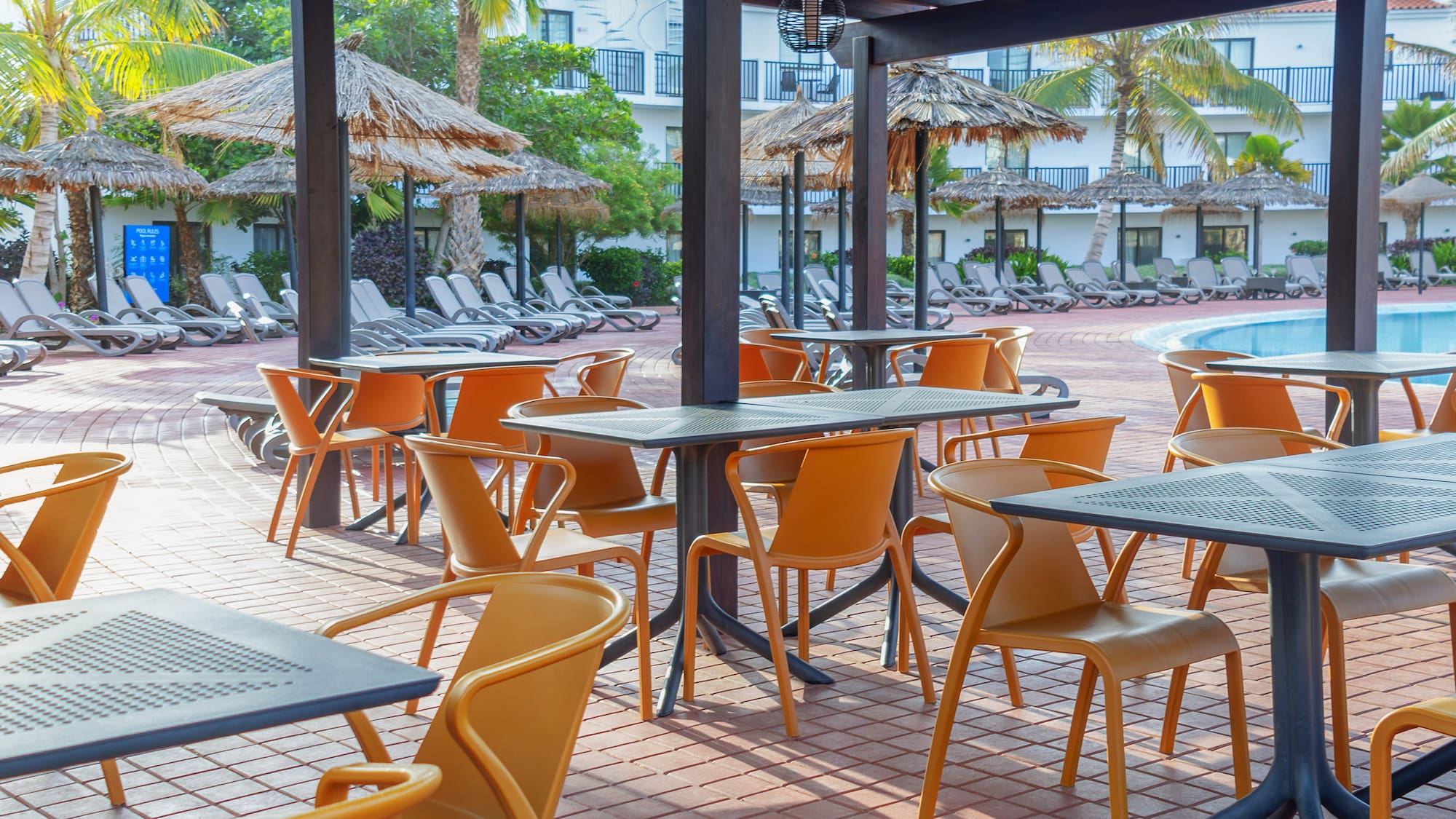a patio with tables and chairs