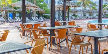 a patio with tables and chairs