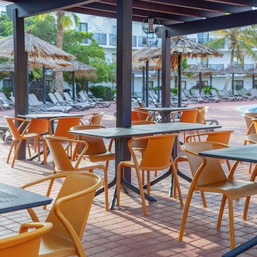 a patio with tables and chairs