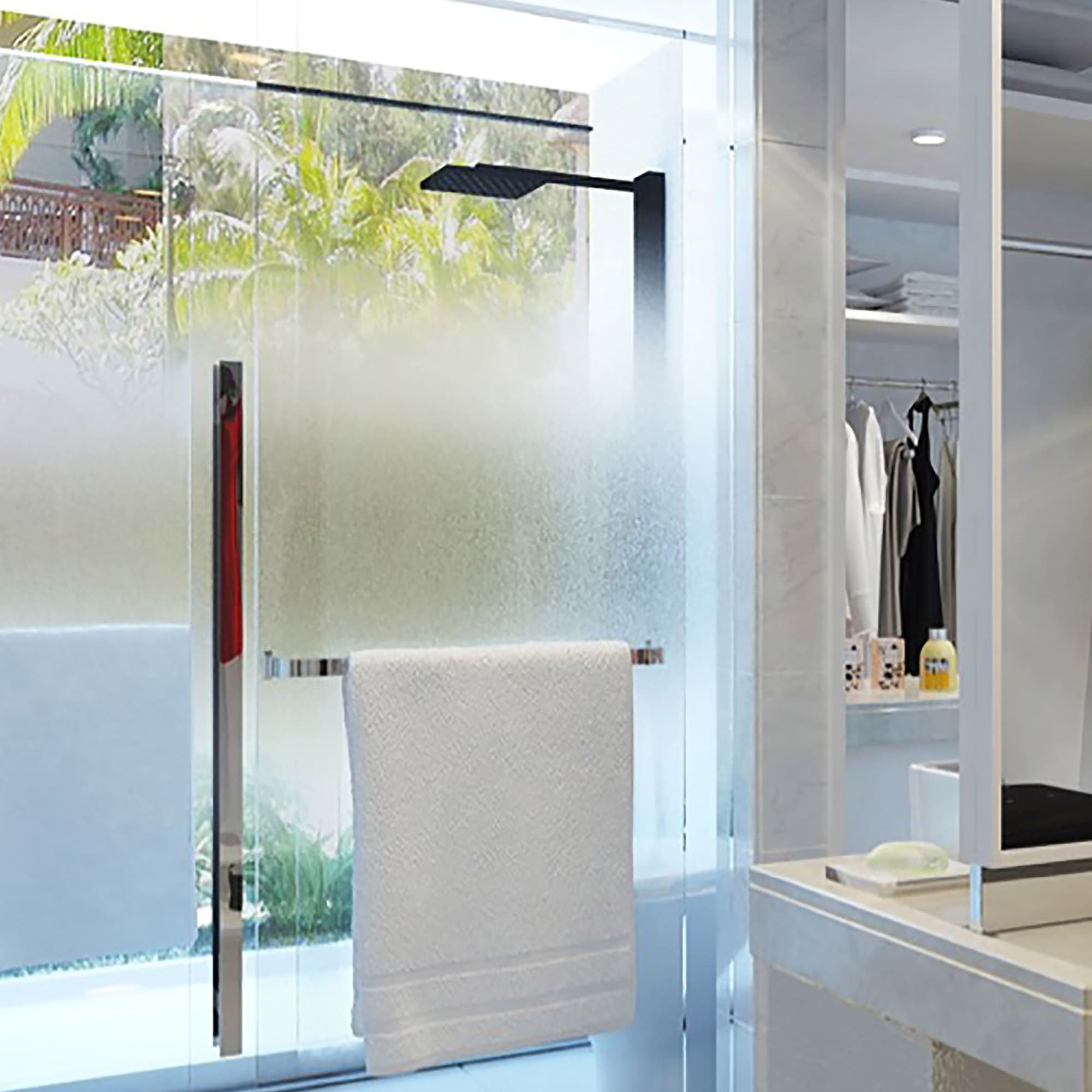 a shower door with a towel on it