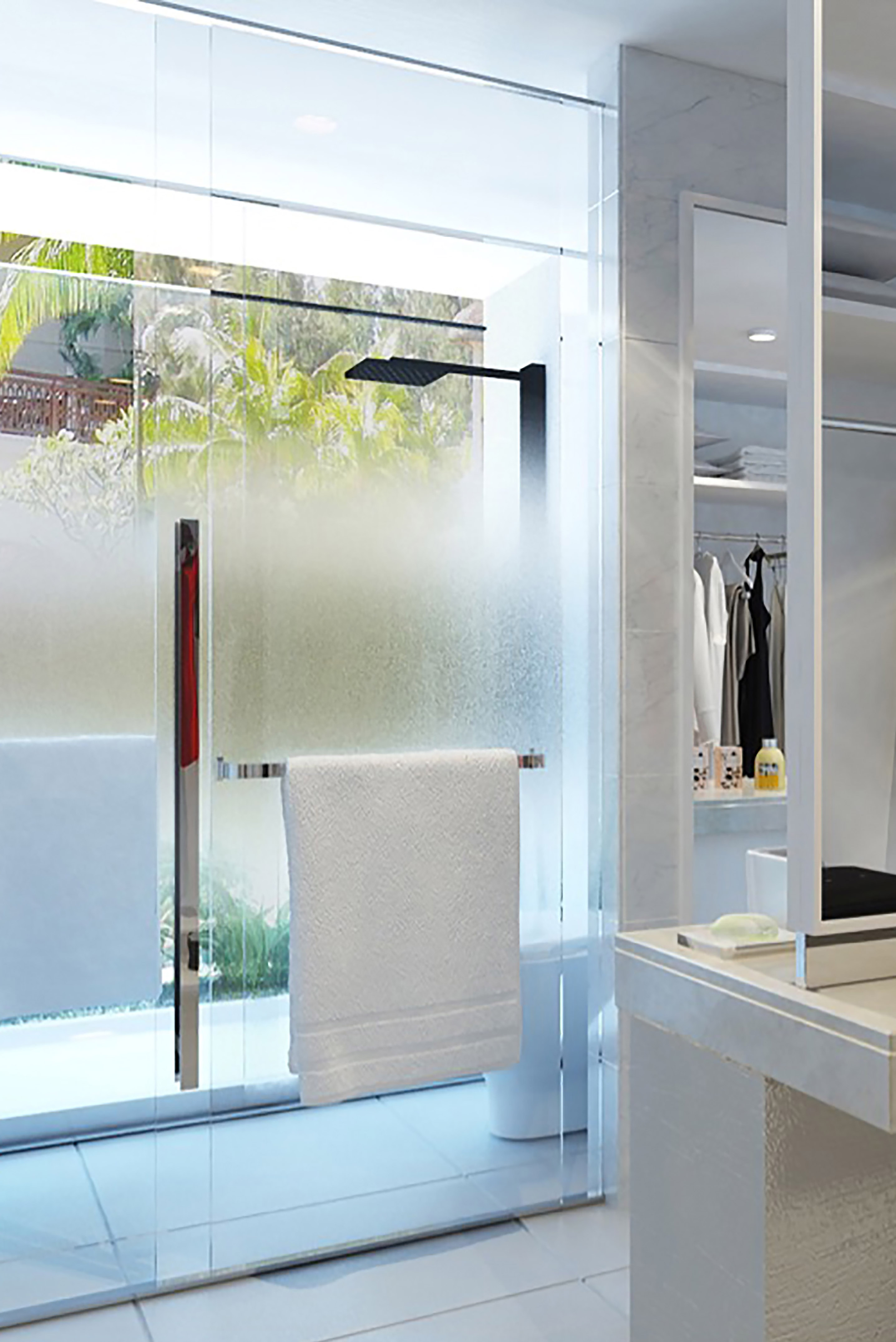 a shower door with a towel on it