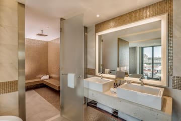 a bathroom with a shower and sink