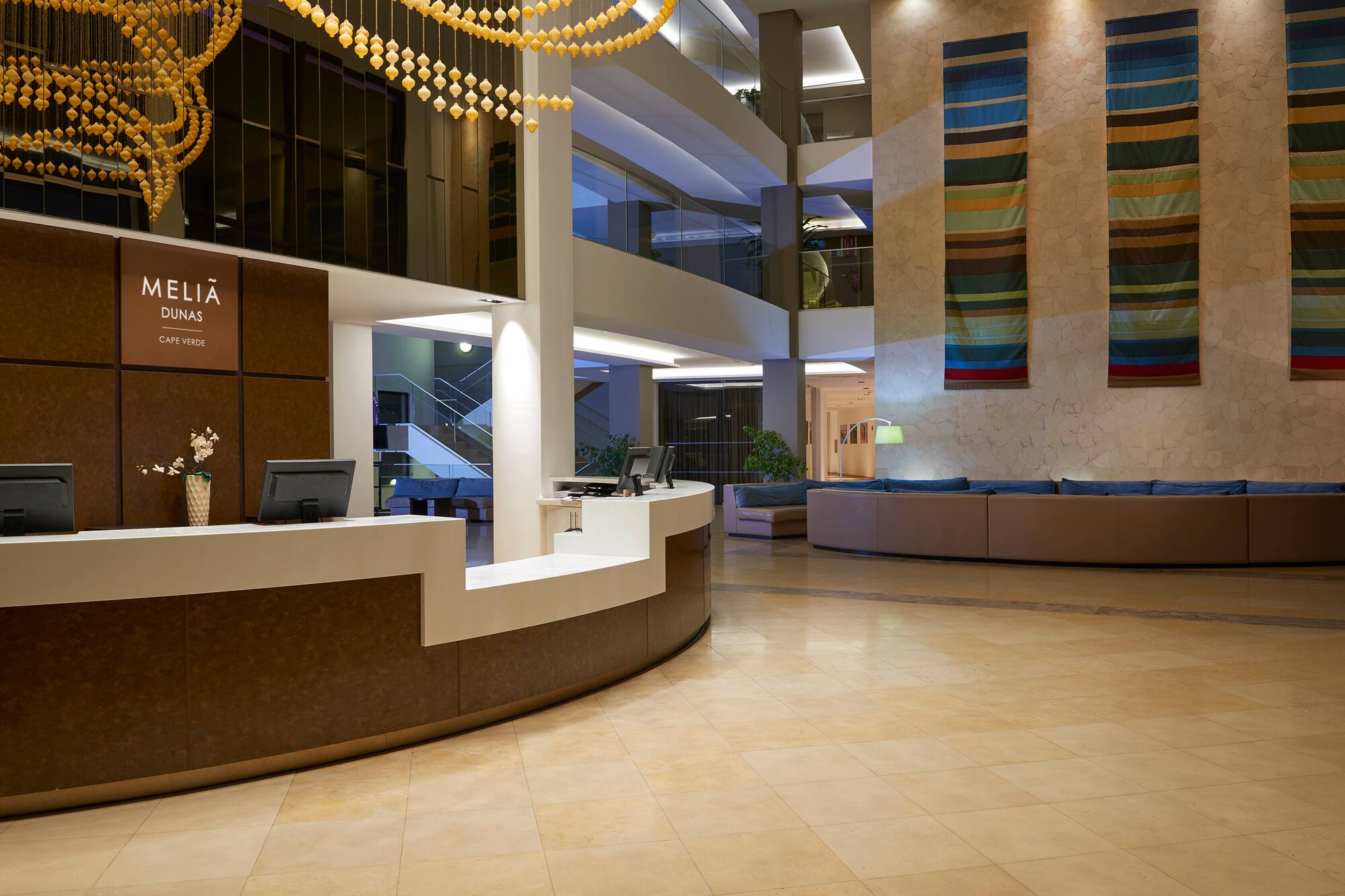 a lobby with a reception desk and a couch