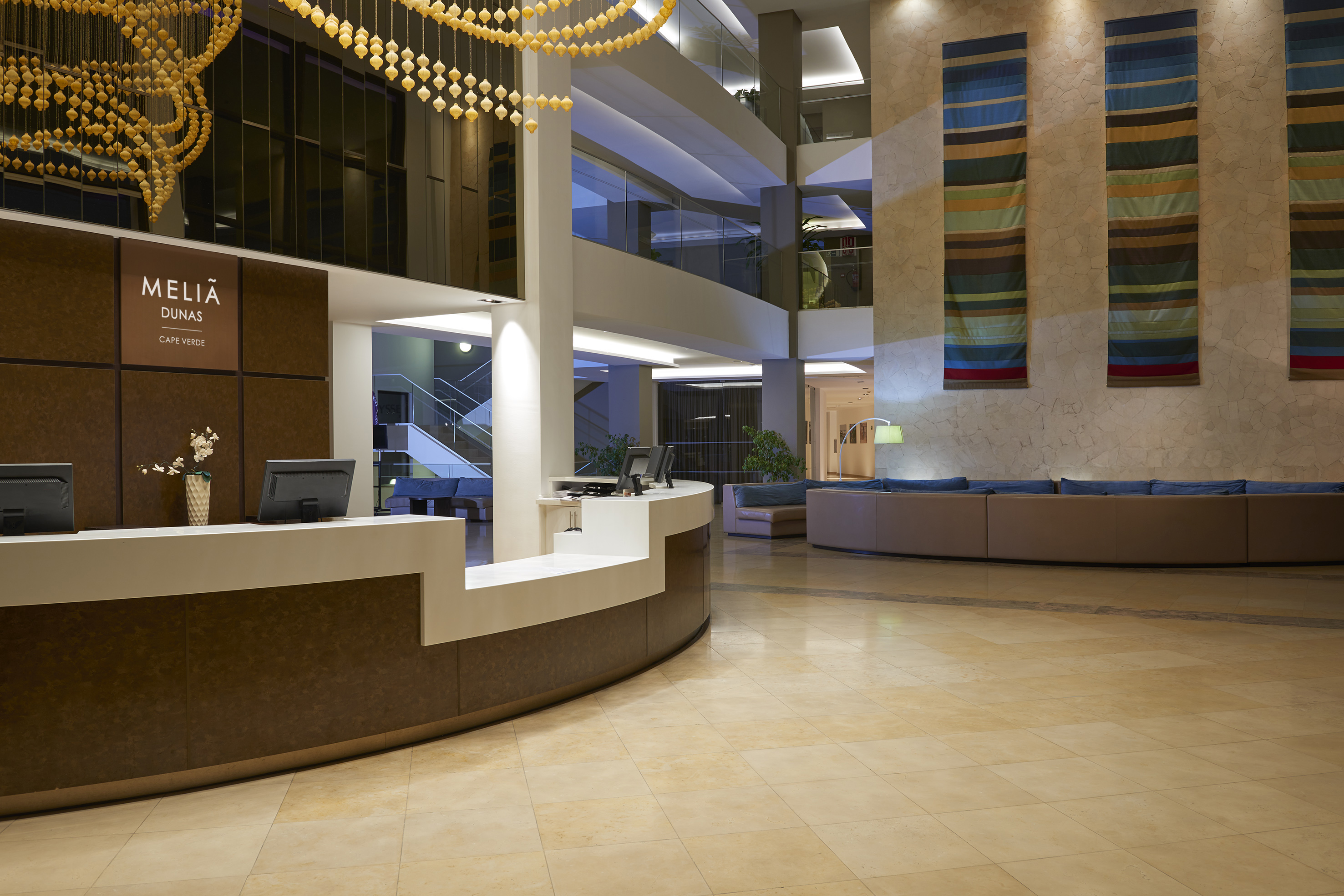 a lobby with a reception desk and a couch