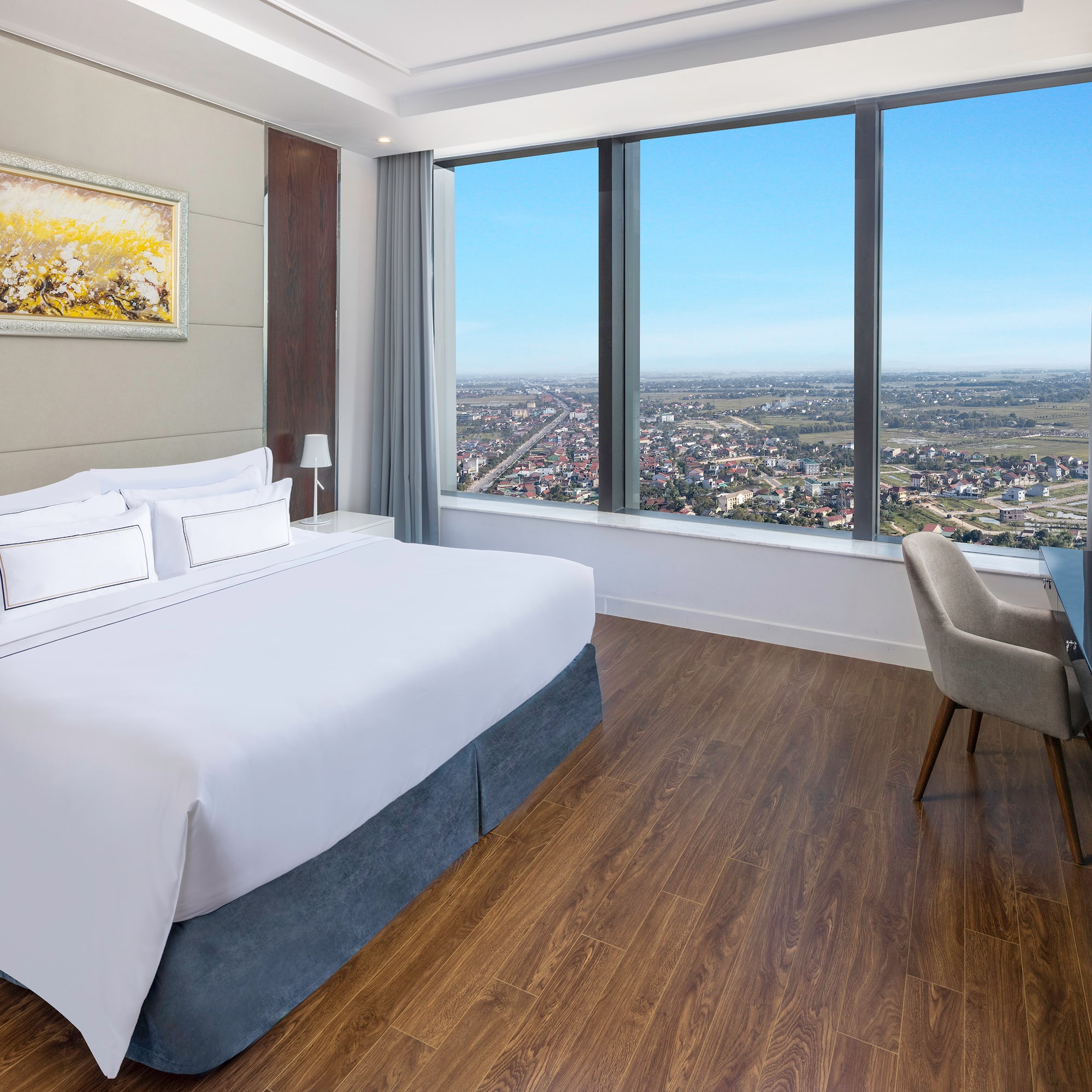 a room with a large window and a bed