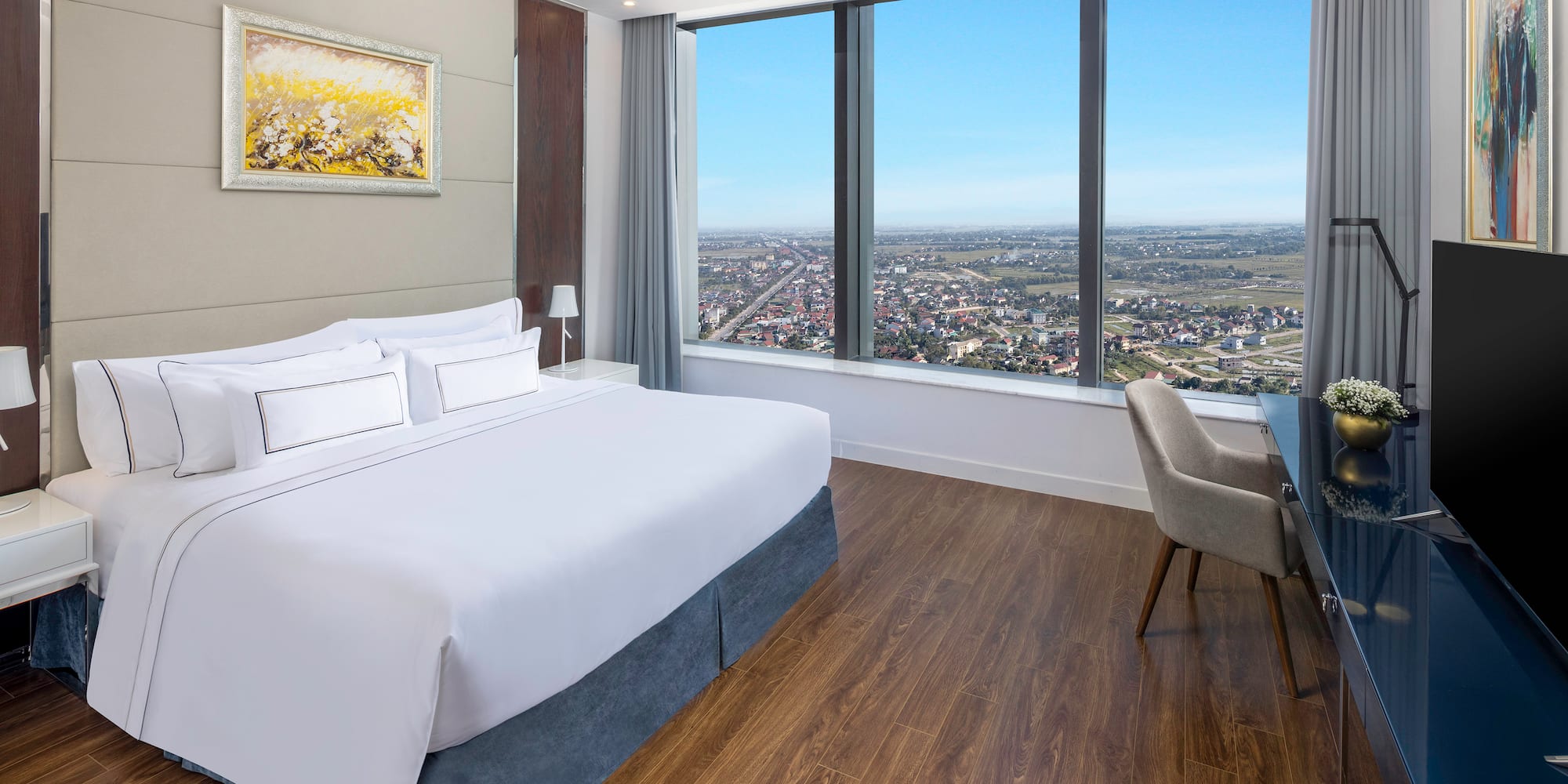 a room with a large window and a bed