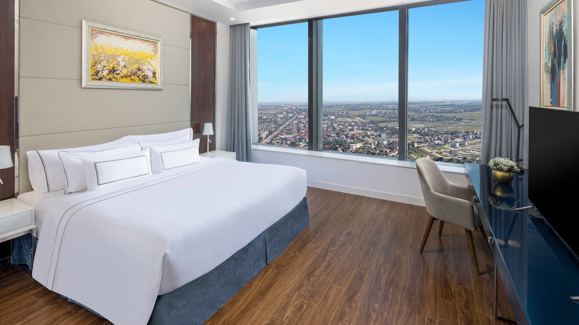 a room with a large window and a bed