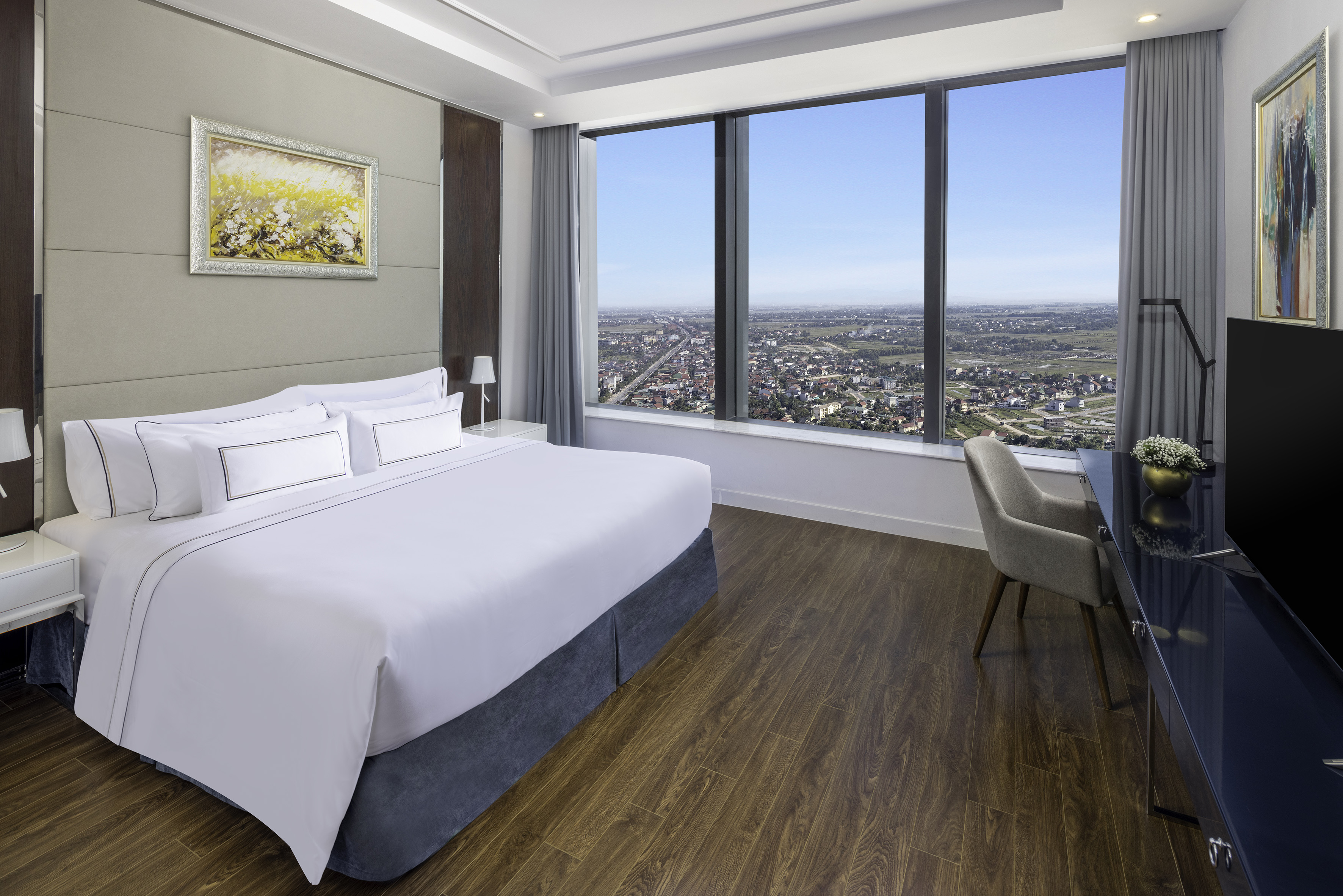 a room with a large window and a bed