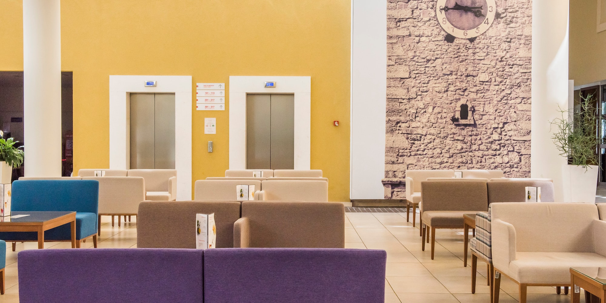 a room with chairs and a clock