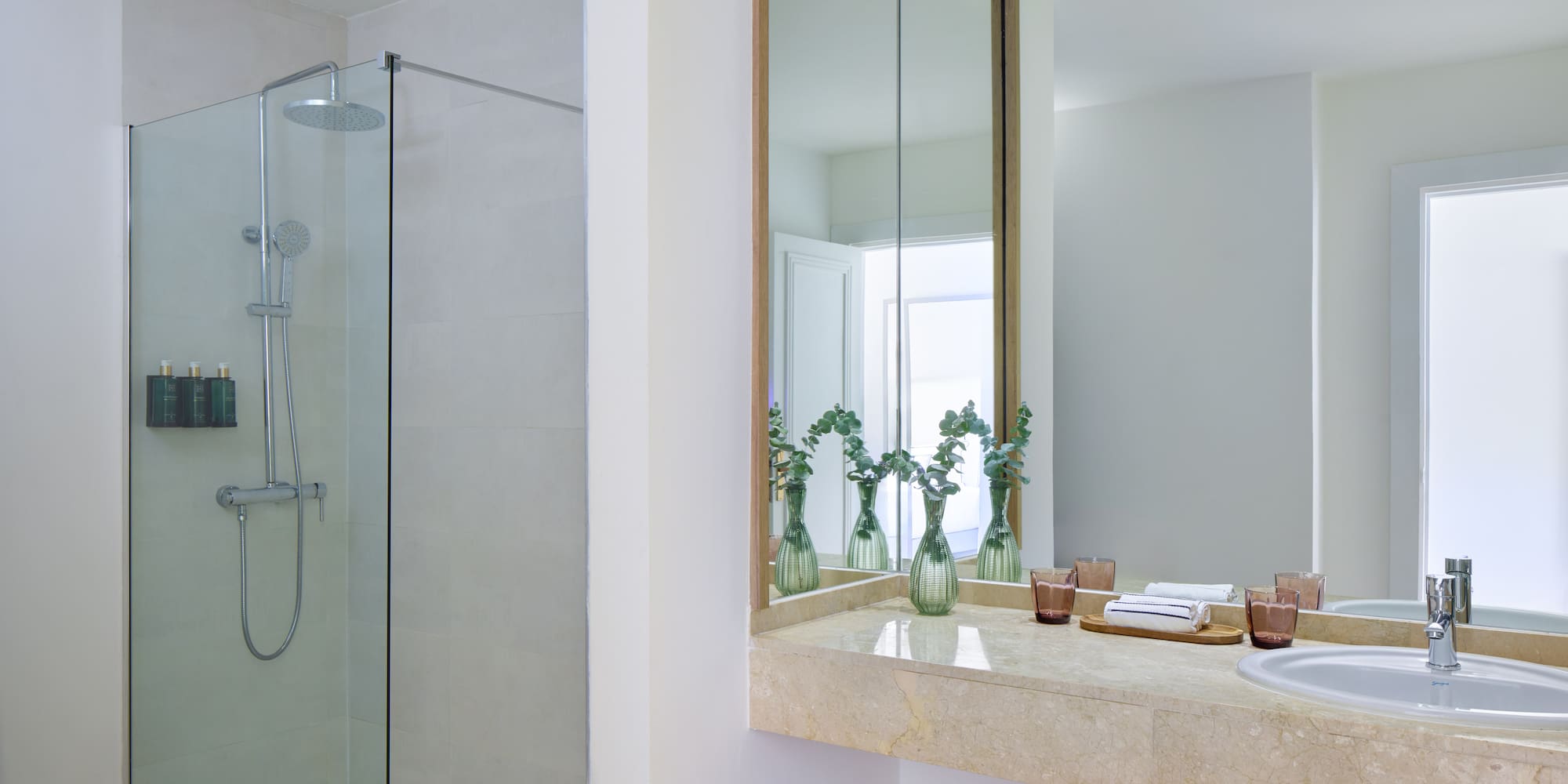 a bathroom with a shower and sink