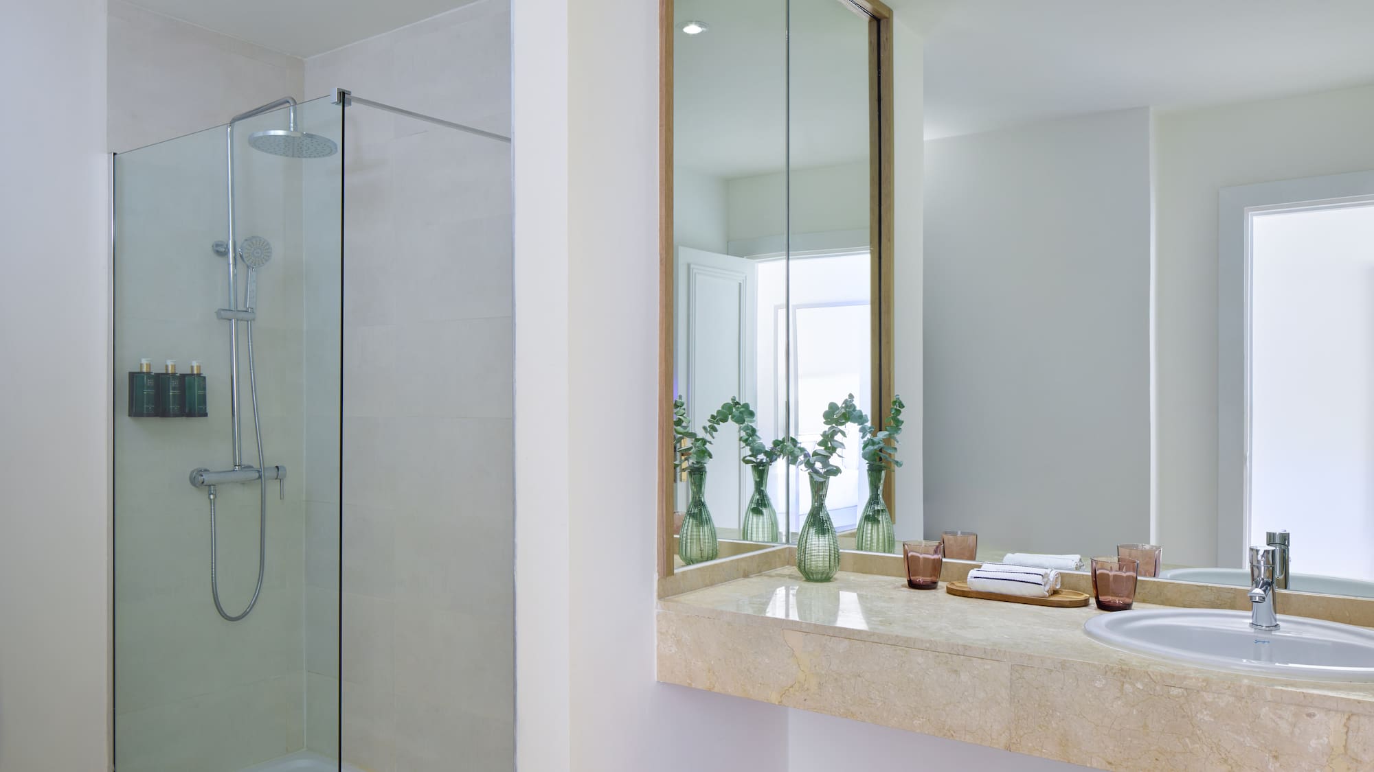 a bathroom with a shower and sink