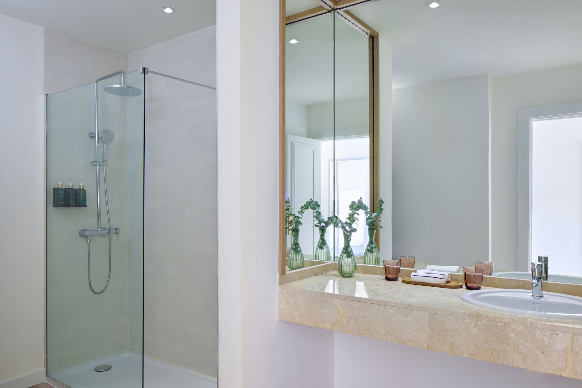 a bathroom with a shower and sink