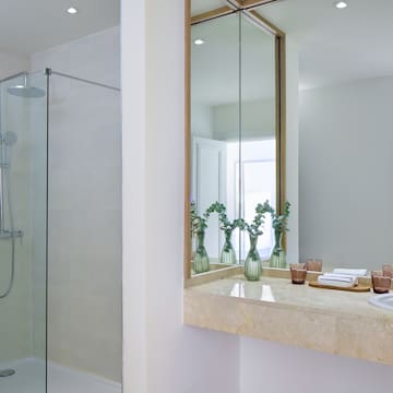 a bathroom with a shower and sink