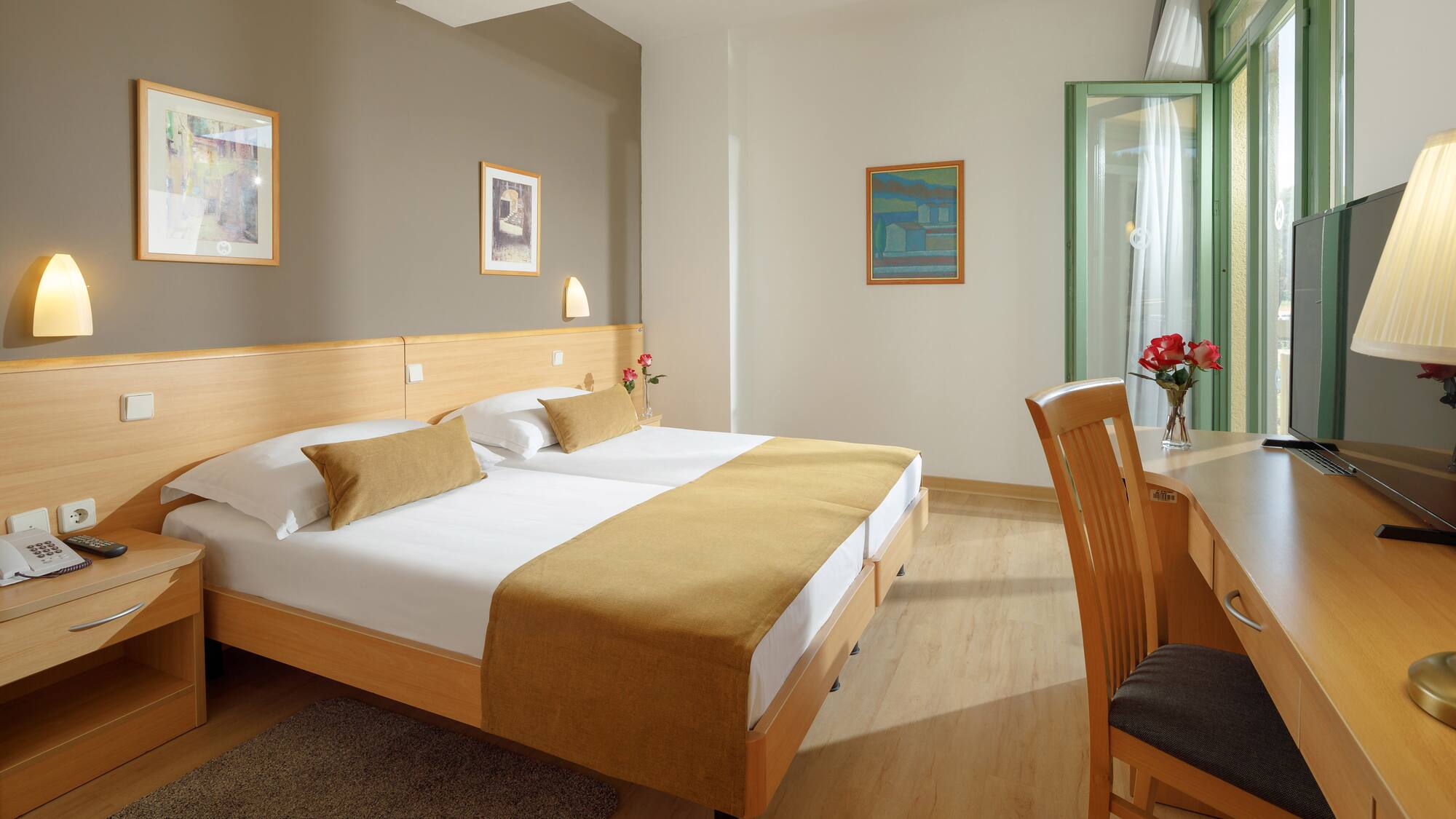 a room with a bed and a desk