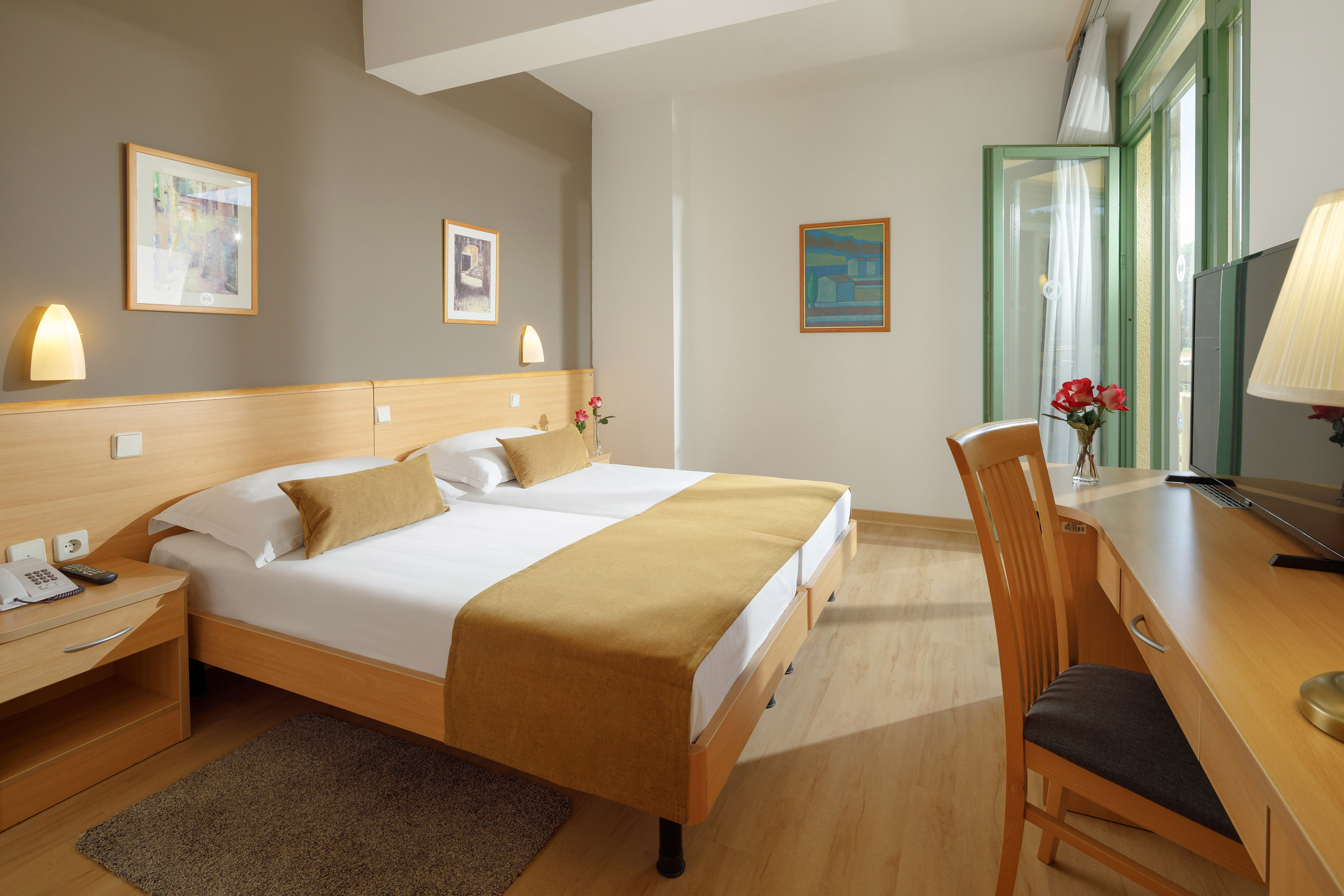 a room with a bed and a desk