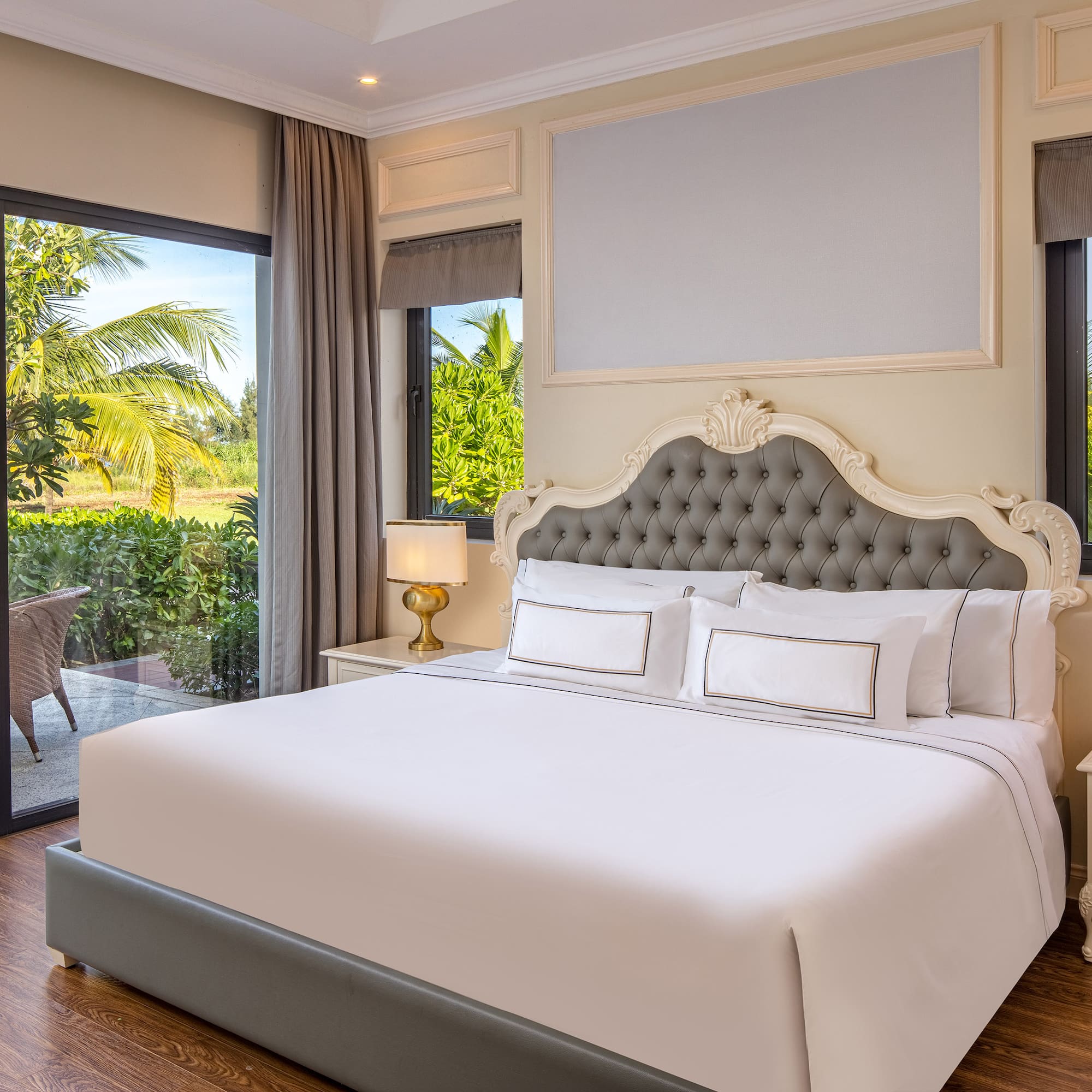 a bed in a room with glass doors