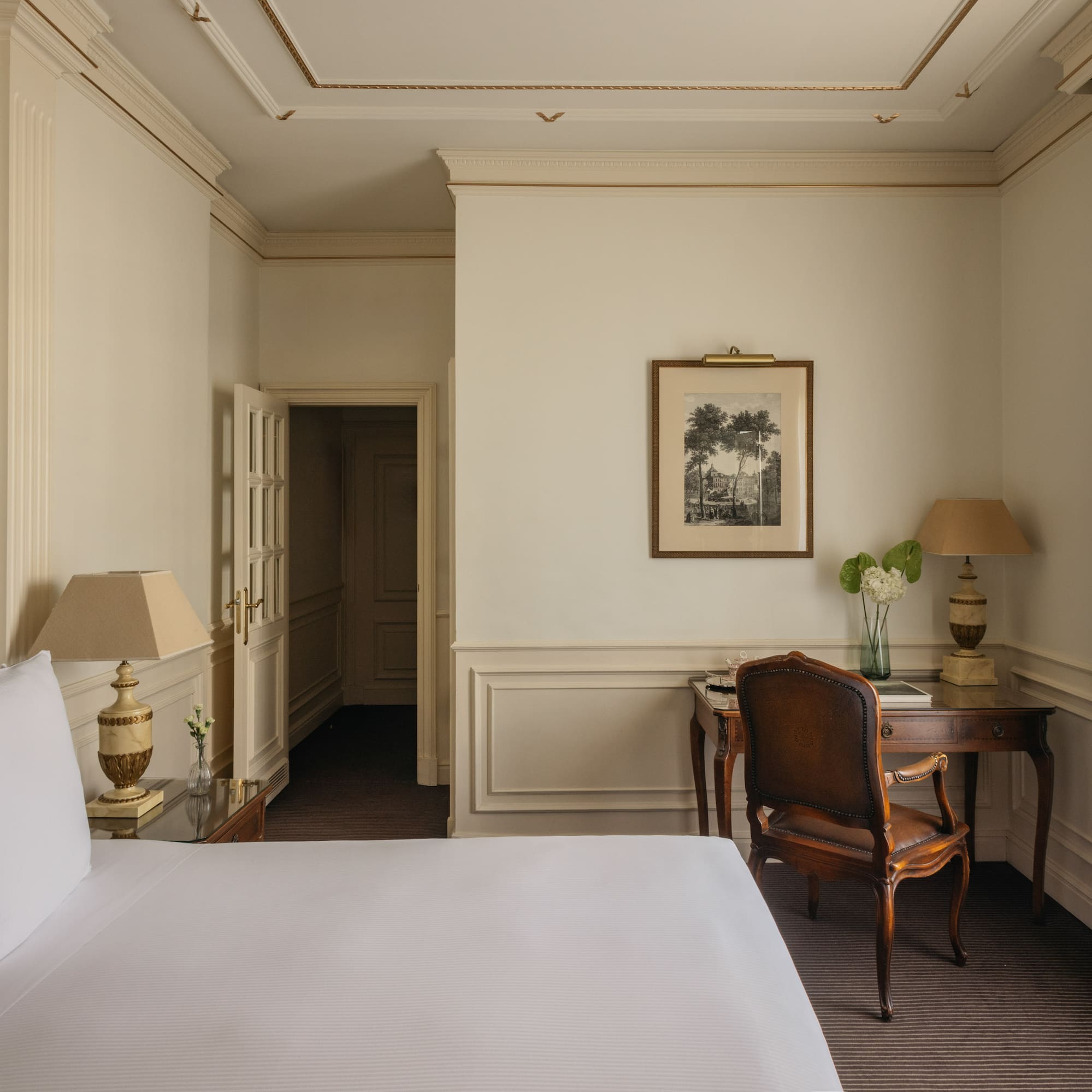 a room with a bed and a desk