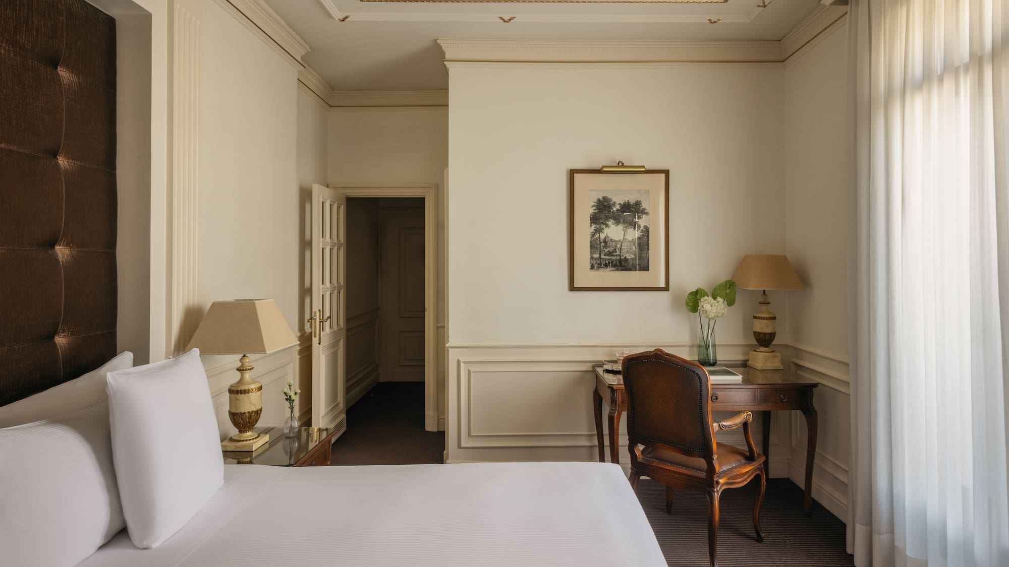 a room with a bed and a desk