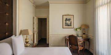 a room with a bed and a desk