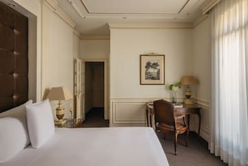 a room with a bed and a desk