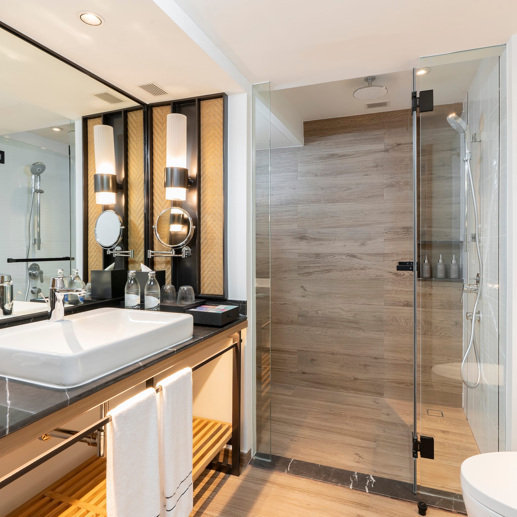 a bathroom with a shower and sink