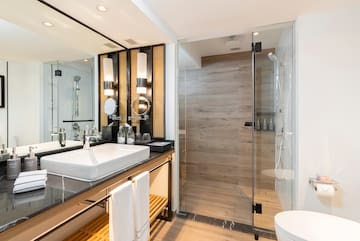 a bathroom with a shower and sink