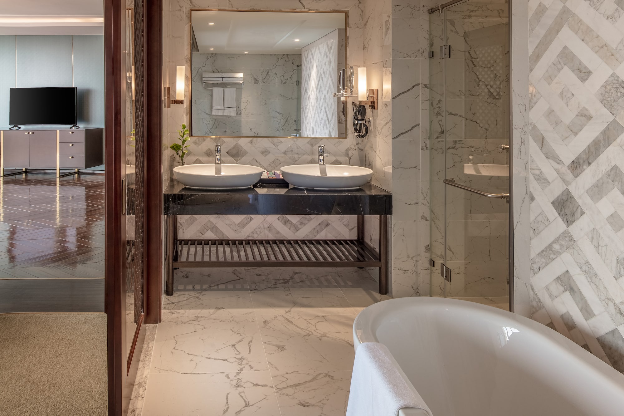 a bathroom with marble tile floor and marble countertop