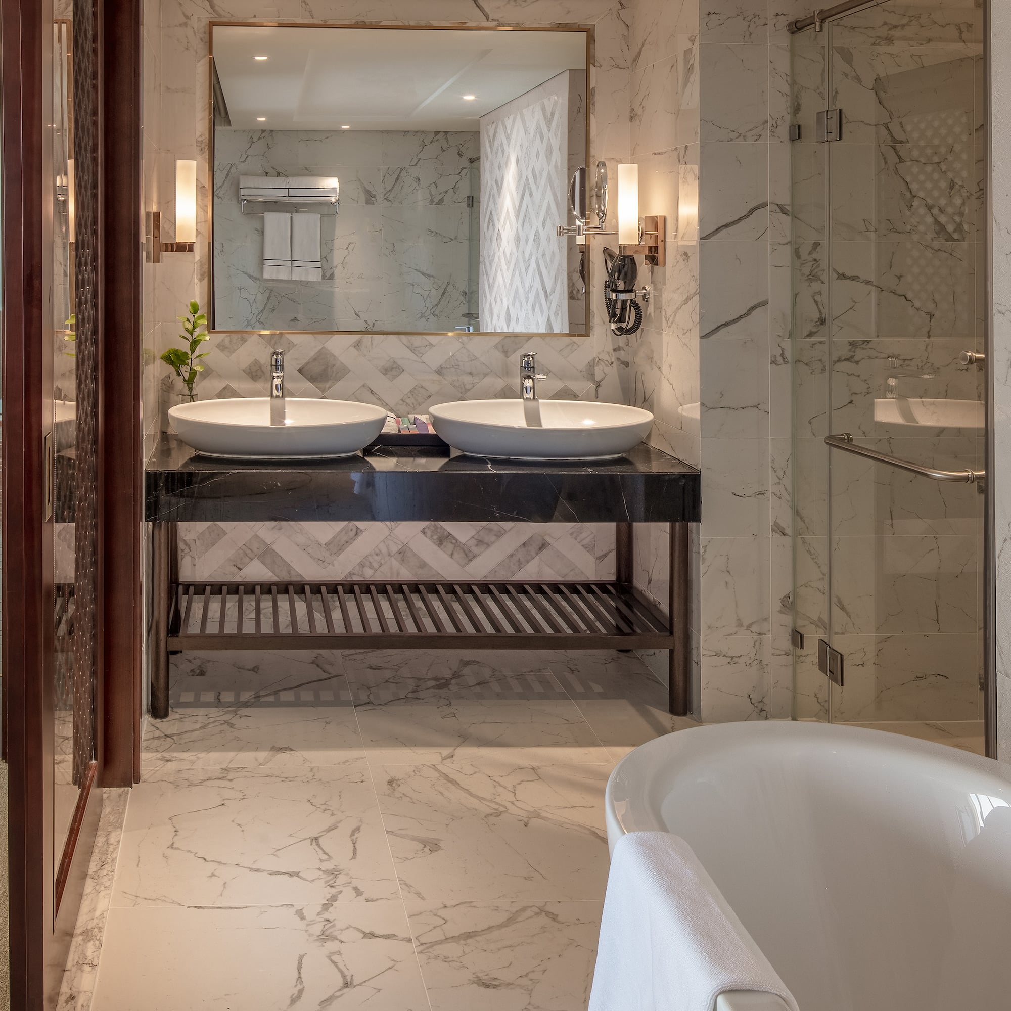 a bathroom with marble tile floor and marble countertop