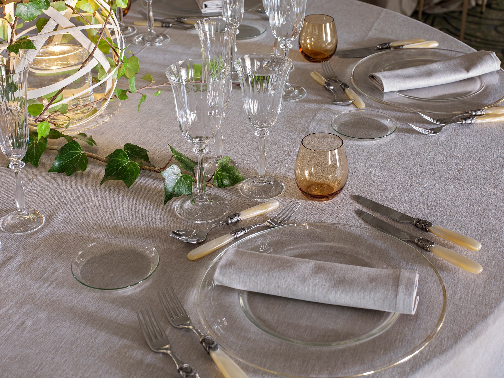 a table set with glasses and plates