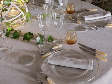 a table set with glasses and plates