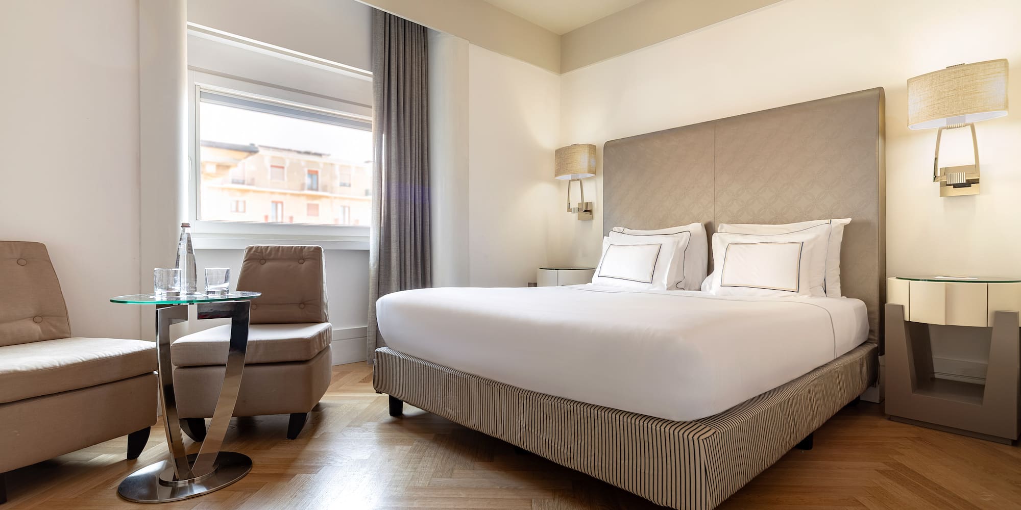 a bedroom with a bed and a chair