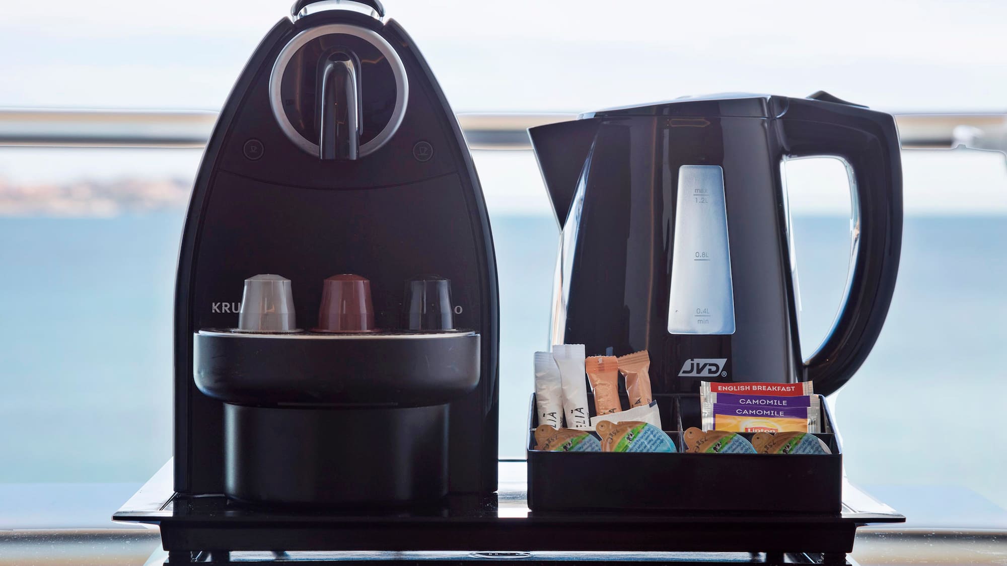 a coffee maker and a container of food