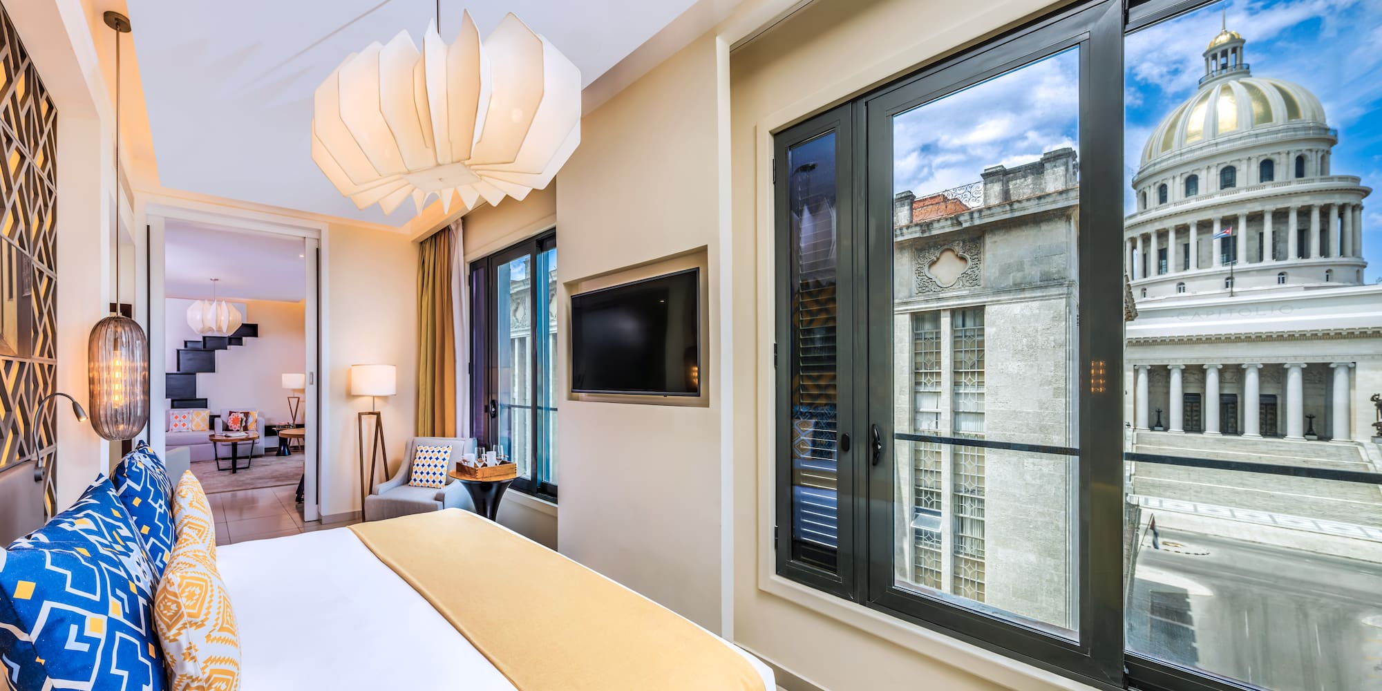 a bedroom with a television and a bed